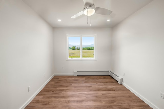 210 Field Rd Unit 44, Stowe, VT 05672 - spare room featuring recessed lighting, wood finished floors, baseboards, a ceiling fan, and a baseboard heating unit
