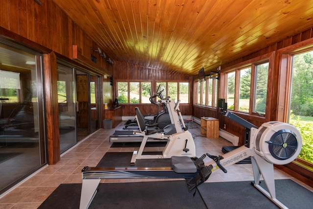 210 Field Rd Unit 44, Stowe, VT 05672 - sunroom featuring baseboard heating, tile patterned flooring, wood walls, vaulted ceiling, and wood ceiling