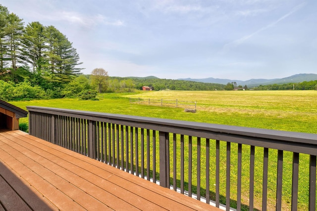 210 Field Rd Unit 44, Stowe, VT 05672 - wooden deck featuring a mountain view, a yard, and a view of countryside