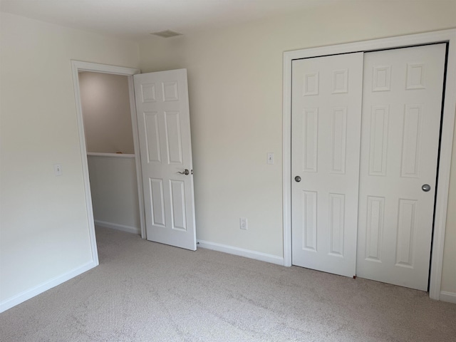 106 Karatzas Ave, Manchester, NH 03104 - unfurnished bedroom featuring carpet flooring, a closet, and baseboards