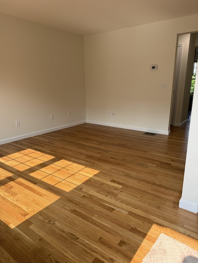 106 Karatzas Ave, Manchester, NH 03104 - empty room with wood finished floors and baseboards