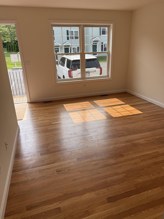 106 Karatzas Ave, Manchester, NH 03104 - spare room featuring wood finished floors and baseboards