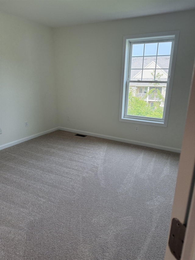 106 Karatzas Ave, Manchester, NH 03104 - unfurnished room featuring baseboards and carpet floors