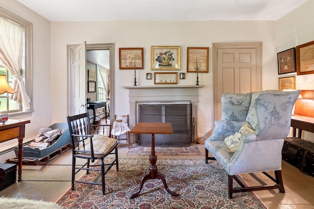 4 Quechee Rd, Hartland, VT 05048 - sitting room featuring healthy amount of natural light and a fireplace with flush hearth