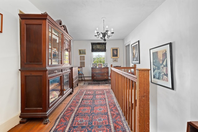 4 Quechee Rd, Hartland, VT 05048 - hall with a chandelier, light wood-style floors, and baseboard heating