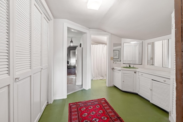4 Quechee Rd, Hartland, VT 05048 - kitchen with lofted ceiling, light countertops, light floors, a sink, and white cabinetry