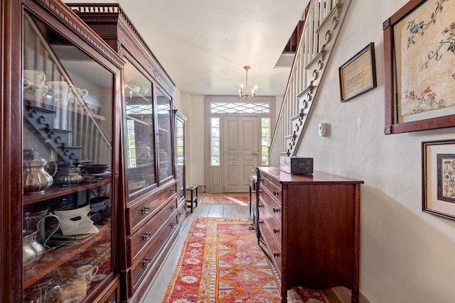 4 Quechee Rd, Hartland, VT 05048 - foyer entrance featuring a chandelier, stairs, and light tile patterned floors