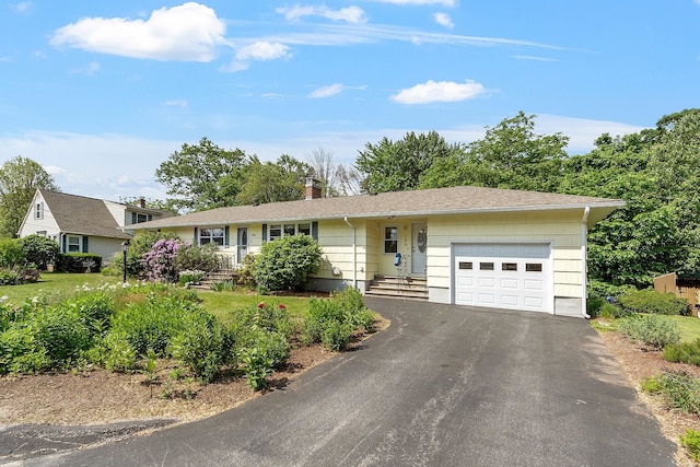 188 Cody St, Manchester, NH 03109 - ranch-style home with a garage, driveway, and a chimney