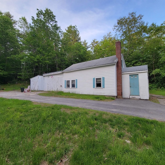 167 Branch Londonderry Tpke, Hopkinton, NH 03229 - view of property exterior with a chimney and driveway