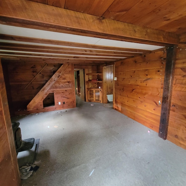 167 Branch Londonderry Tpke, Hopkinton, NH 03229 - unfurnished living room featuring wooden walls and wooden ceiling with exposed beams