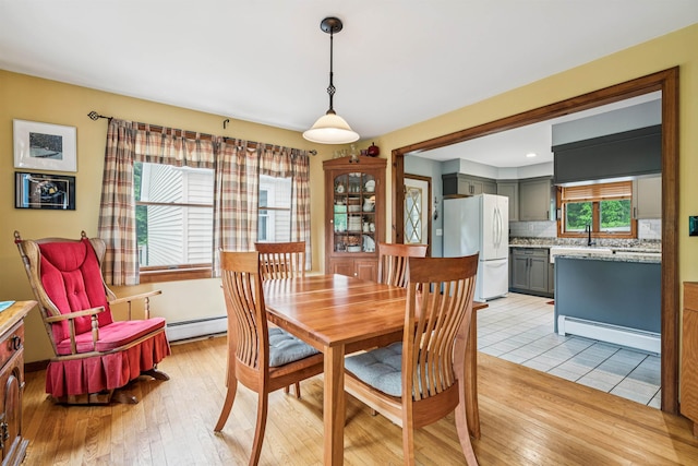530 W Rd, Barnard, VT 05031 - dining space with baseboard heating and light wood-style floors