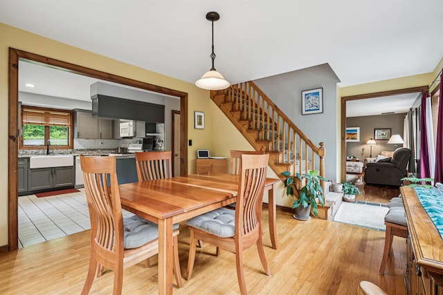 530 W Rd, Barnard, VT 05031 - dining space featuring stairway and light wood-style floors