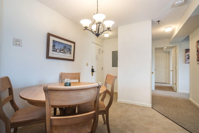 133 E Mountain Rd Unit 3D13, Killington, VT 05751 - dining area featuring a chandelier, baseboards, electric panel, and light tile patterned floors