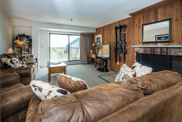 133 E Mountain Rd Unit 3D13, Killington, VT 05751 - living room featuring carpet, wood walls, and a brick fireplace