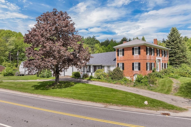 1519 New Boston Rd, Francestown, NH 03043 - view of front of property featuring a chimney, a front lawn, asphalt driveway, and brick siding