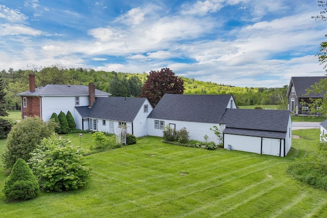 1519 New Boston Rd, Francestown, NH 03043 - back of house with a chimney, a yard, and an outdoor structure