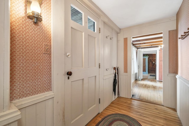 1519 New Boston Rd, Francestown, NH 03043 - entryway featuring a wainscoted wall, light wood-style floors, wallpapered walls, and a decorative wall