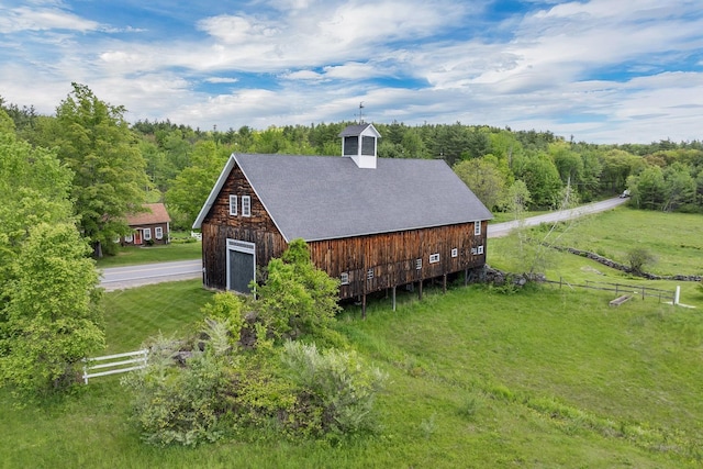 1519 New Boston Rd, Francestown, NH 03043 - view of side of property featuring a barn, a garage, an outbuilding, and a shingled roof