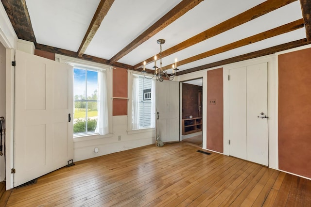 1519 New Boston Rd, Francestown, NH 03043 - unfurnished bedroom with a chandelier, hardwood / wood-style flooring, and beam ceiling