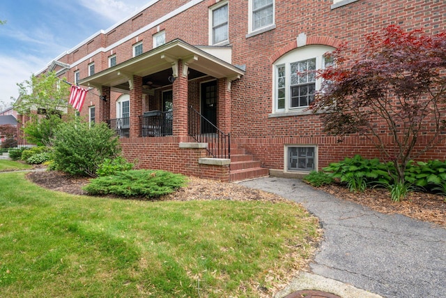 647 Canal St, Manchester, NH 03101 - view of front of home with brick siding and a front lawn