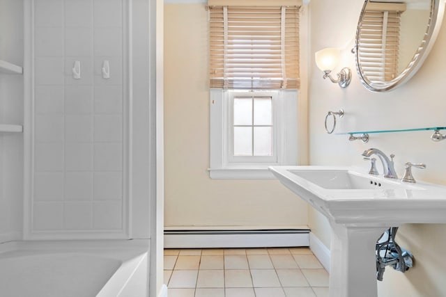 647 Canal St, Manchester, NH 03101 - full bath featuring a baseboard heating unit, tile patterned flooring, and  shower combination