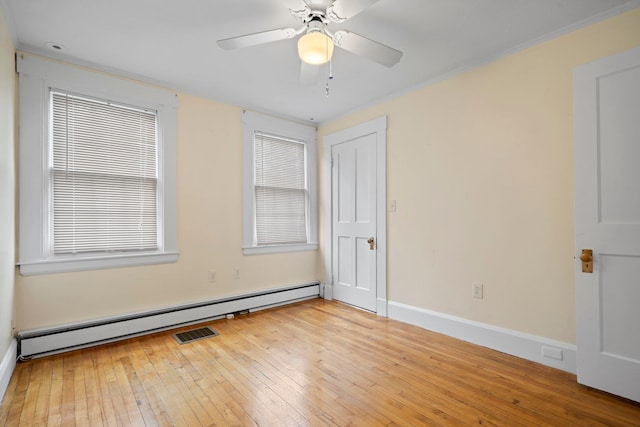 647 Canal St, Manchester, NH 03101 - unfurnished bedroom with hardwood / wood-style floors, ornamental molding, baseboard heating, baseboards, and ceiling fan