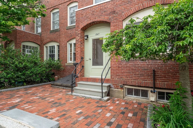 647 Canal St, Manchester, NH 03101 - view of exterior entry featuring brick siding