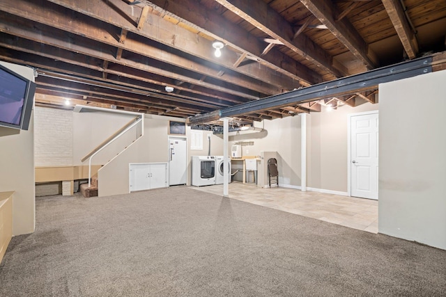 647 Canal St, Manchester, NH 03101 - finished basement with independent washer and dryer, carpet flooring, stairs, freestanding refrigerator, and wood ceiling