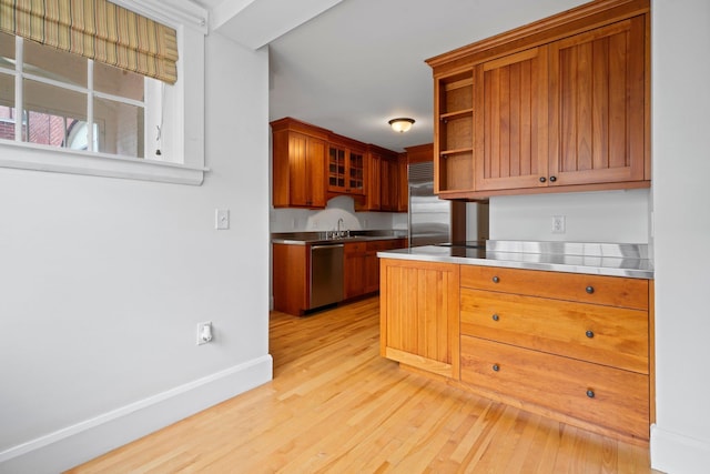 647 Canal St, Manchester, NH 03101 - kitchen with stainless steel countertops, appliances with stainless steel finishes, a sink, light wood-style flooring, and open shelves