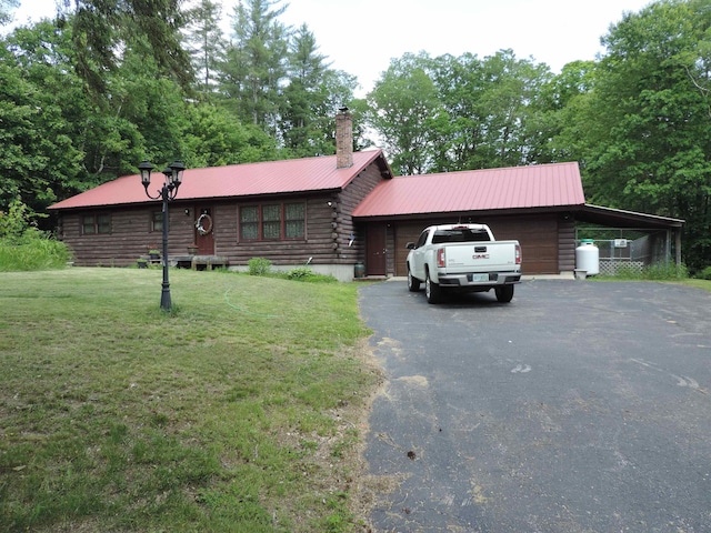 74 Pine Ridge Rd, Hillsborough, NH 03244 - cabin with driveway, a front yard, log exterior, metal roof, and a chimney