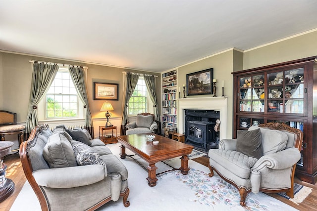 160 Old Stagecoach Rd, Bennington, NH 03442 - living area featuring a wood stove, wood finished floors, ornamental molding, and built in features