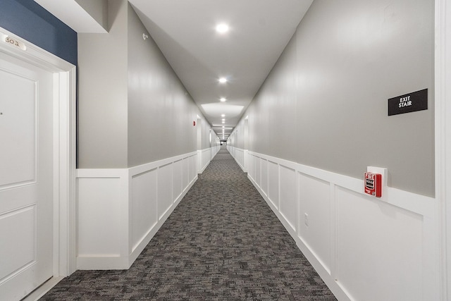 10100 S Willow St Unit 105, Manchester, NH 03103 - corridor featuring a decorative wall, dark carpet, recessed lighting, and wainscoting
