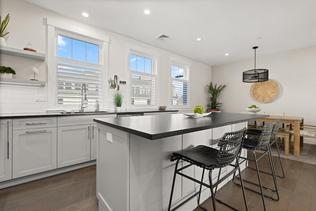 25 Little Bay Dr, Dover, NH 03820 - kitchen featuring a sink, dark wood-style floors, dark countertops, and recessed lighting
