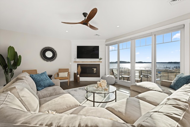 25 Little Bay Dr, Dover, NH 03820 - living area with wood finished floors, ceiling fan, a fireplace, and recessed lighting