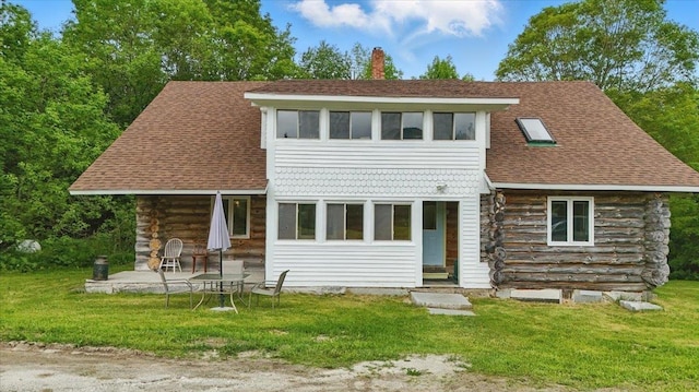 458 Woodcock Rd, Plainfield, VT 05667 - view of front of property featuring a chimney, a patio, a front lawn, roof with shingles, and log exterior
