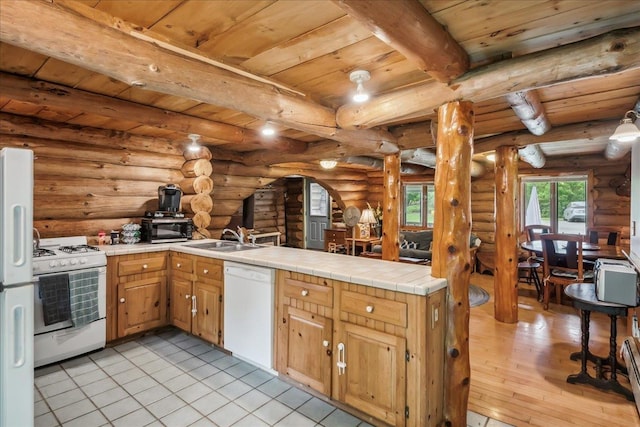 458 Woodcock Rd, Plainfield, VT 05667 - kitchen featuring white appliances, wooden ceiling with exposed beams, a sink, tile countertops, and a peninsula