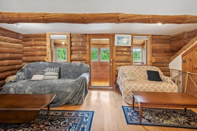 458 Woodcock Rd, Plainfield, VT 05667 - living area with log walls and hardwood / wood-style floors