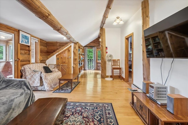 458 Woodcock Rd, Plainfield, VT 05667 - living room featuring rustic walls, plenty of natural light, and hardwood / wood-style flooring