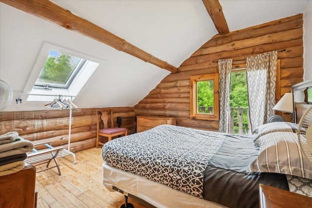 458 Woodcock Rd, Plainfield, VT 05667 - bedroom featuring rustic walls, multiple windows, hardwood / wood-style flooring, and a skylight