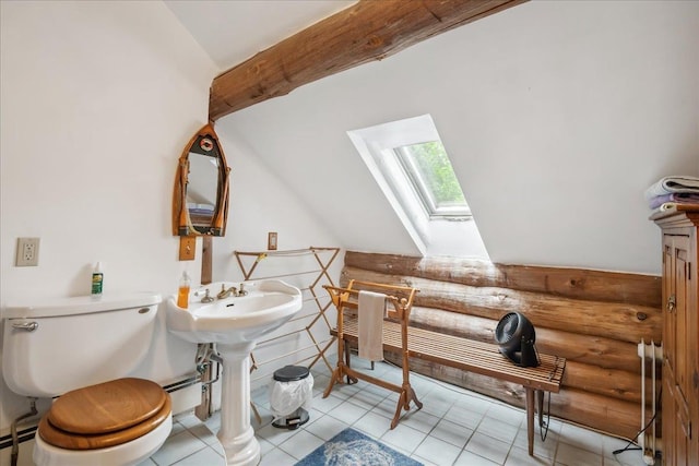 458 Woodcock Rd, Plainfield, VT 05667 - half bathroom with a skylight, rustic walls, toilet, vaulted ceiling, and baseboard heating