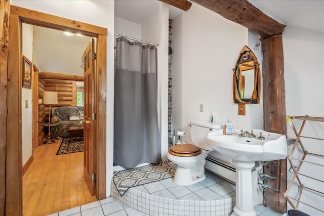 458 Woodcock Rd, Plainfield, VT 05667 - full bath with toilet, curtained shower, rustic walls, a sink, and wood finished floors