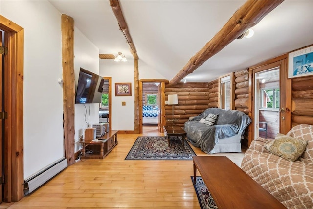 458 Woodcock Rd, Plainfield, VT 05667 - living room featuring log walls, a baseboard heating unit, and light wood-style floors
