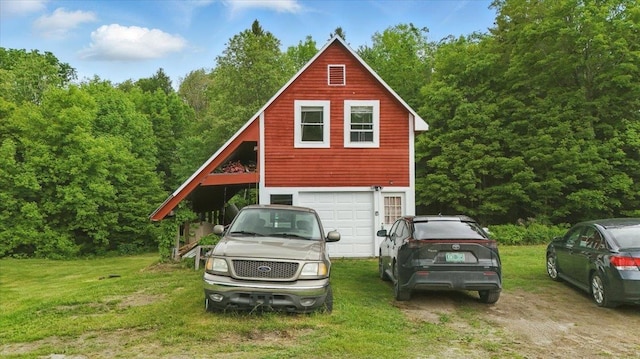 458 Woodcock Rd, Plainfield, VT 05667 - view of front of property featuring a front yard, an attached garage, and driveway
