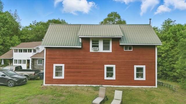 458 Woodcock Rd, Plainfield, VT 05667 - view of home's exterior featuring cooling unit, metal roof, and a lawn