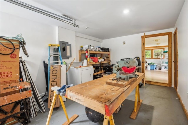 458 Woodcock Rd, Plainfield, VT 05667 - garage with electric panel and washer / clothes dryer