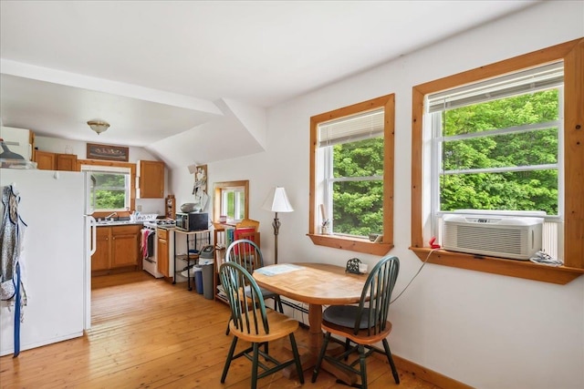 458 Woodcock Rd, Plainfield, VT 05667 - dining space with plenty of natural light, light wood-style flooring, cooling unit, and baseboards