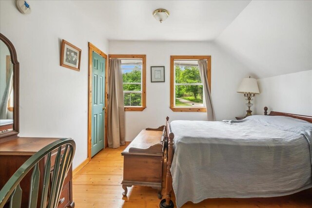 458 Woodcock Rd, Plainfield, VT 05667 - bedroom featuring light wood-style floors and lofted ceiling