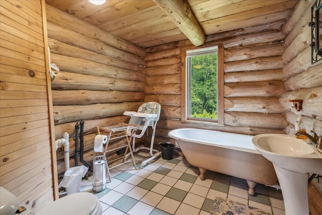 458 Woodcock Rd, Plainfield, VT 05667 - bathroom featuring wood ceiling with exposed beams, a soaking tub, toilet, and tile patterned floors