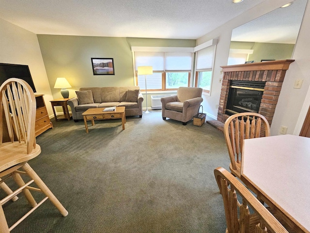 156 Deer Park Dr Unit 127D, Woodstock, NH 03262 - living area featuring a fireplace, carpet flooring, baseboards, and an AC wall unit