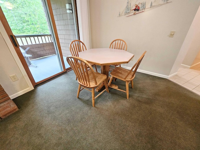 156 Deer Park Dr Unit 127D, Woodstock, NH 03262 - dining space featuring baseboards, dark colored carpet, and dark tile patterned floors